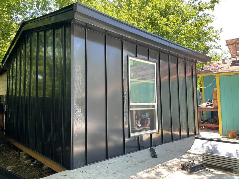 Black standing seam metal wall panels for Roof Inspection in Benner