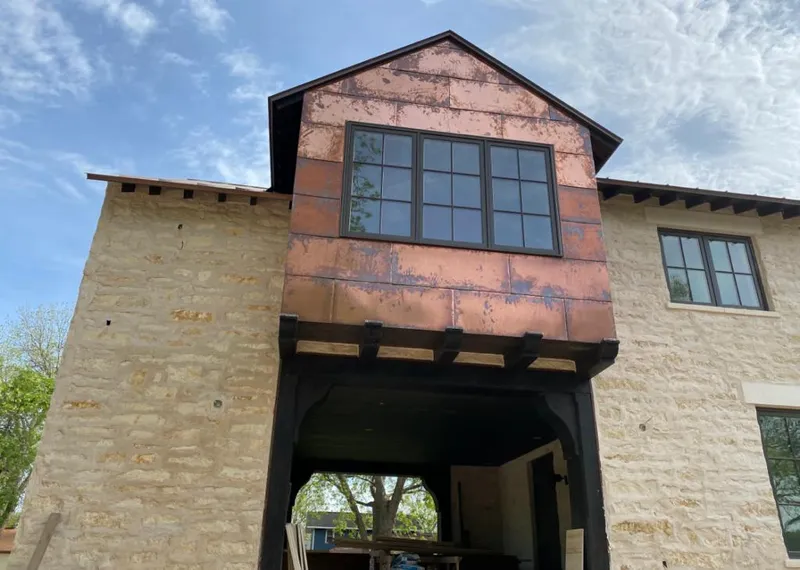 Copper metal panel facade on a stone building for Metal Roof Coating in Benner